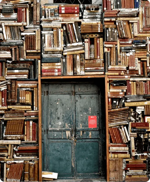 Antique books arranged around a vintage doorway